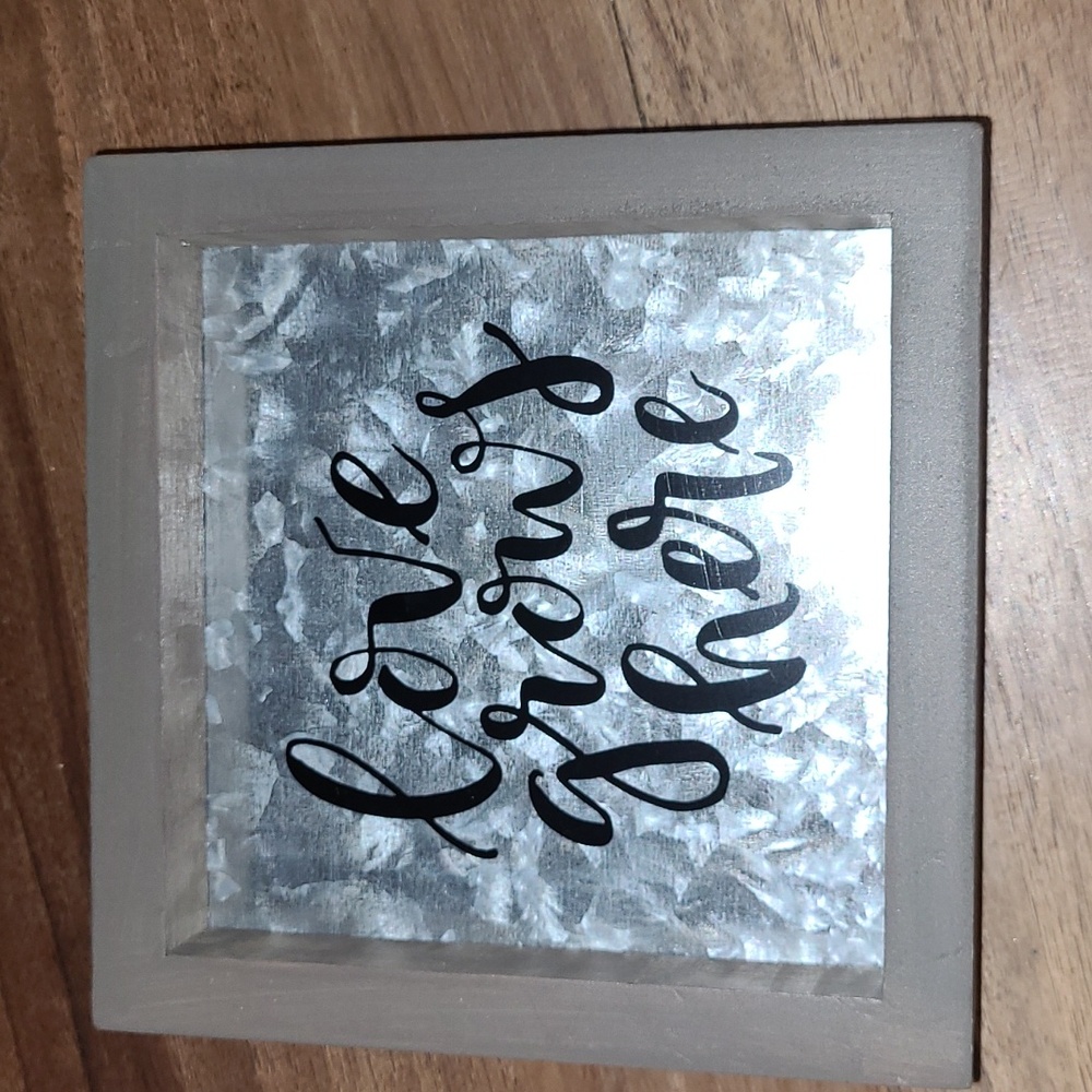 Love grows here wood and metal sign